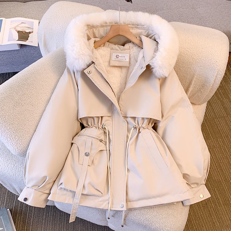 Close-up of the plush faux fur hood trim on the Odette winter coat in white