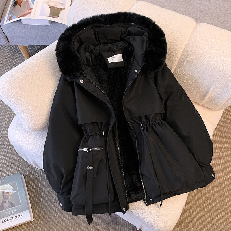 Odette winter coat in black with adjustable waist detail, styled with winter accessories