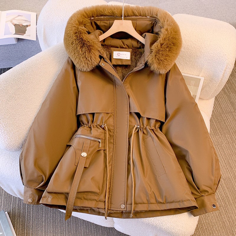 Side view of woman in the Odette khaki fur-trimmed coat showing tailored silhouette