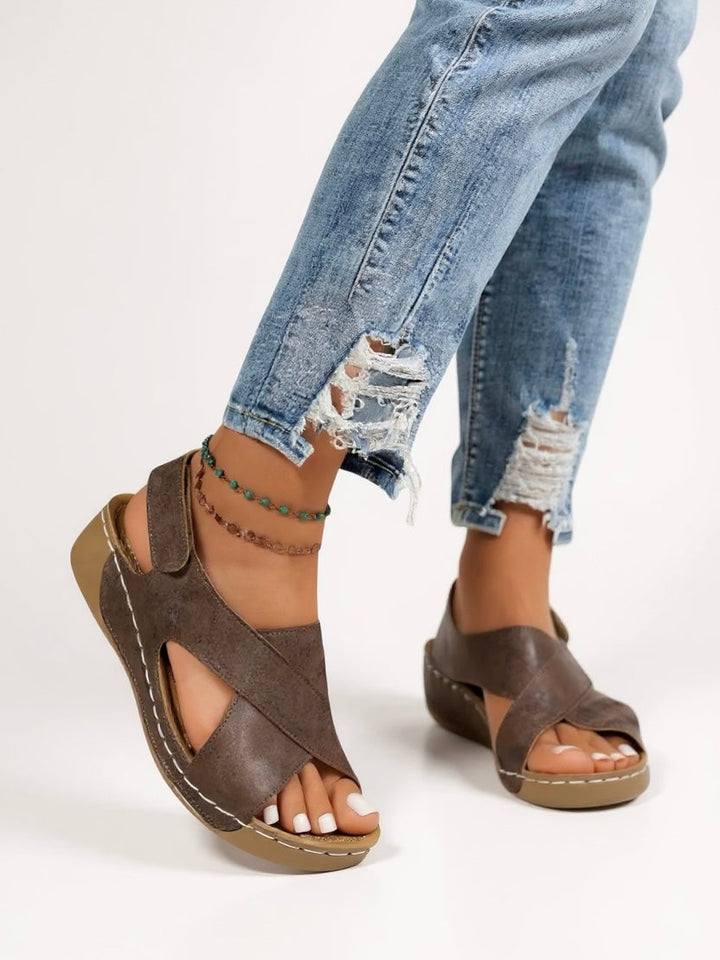 Olive platform wedge sandals in dark brown displayed at an angle