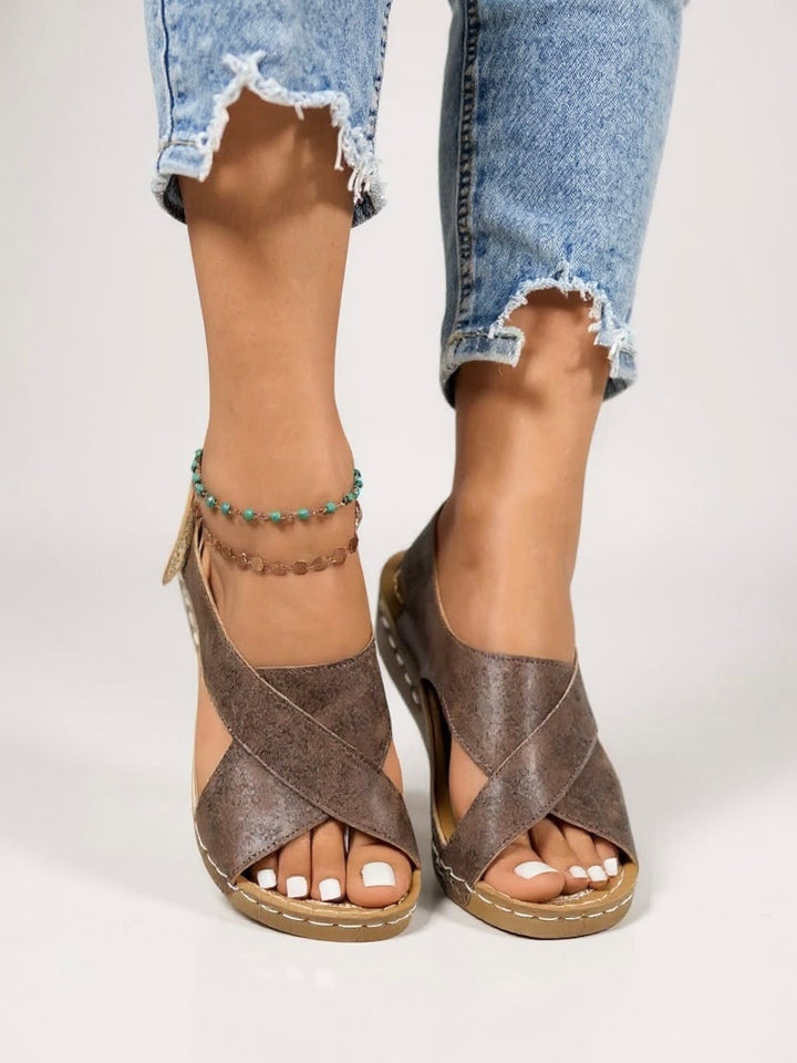 Olive platform wedge sandals in black styled on a model's feet