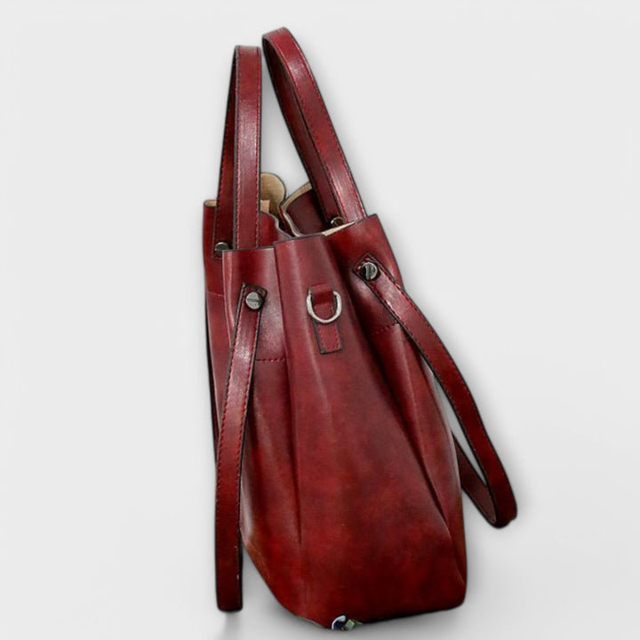 Model wearing the Olivia shoulder bag in red styled with a casual everyday outfit