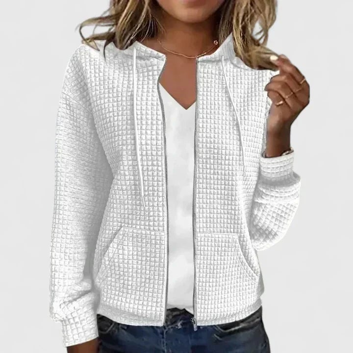 Detail shot of the Olivia elegant cardigan fabric texture, emphasizing its soft, flexible construction