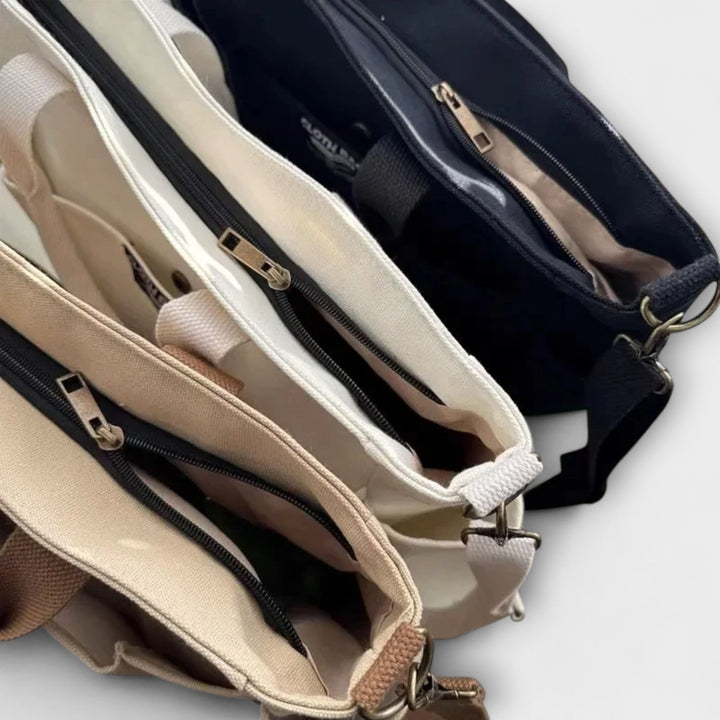 Olivia Shoulder Bag in White showing structured silhouette and organized interior pockets