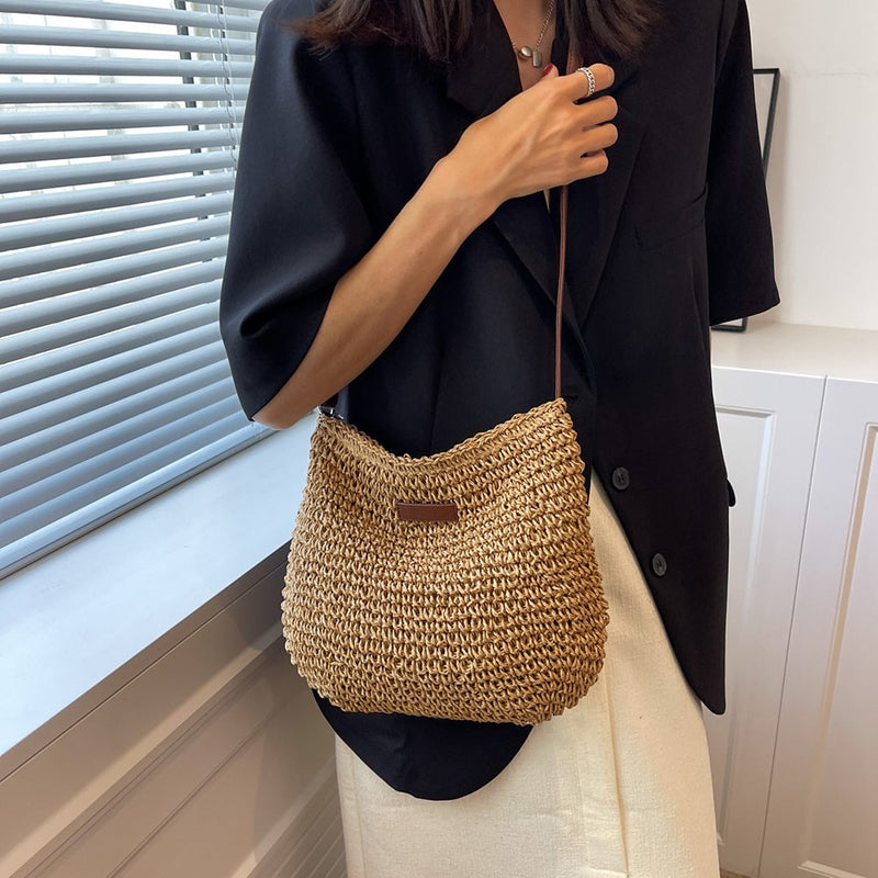 Close-up detail of the Olivia shoulder bag strap and hardware in beige