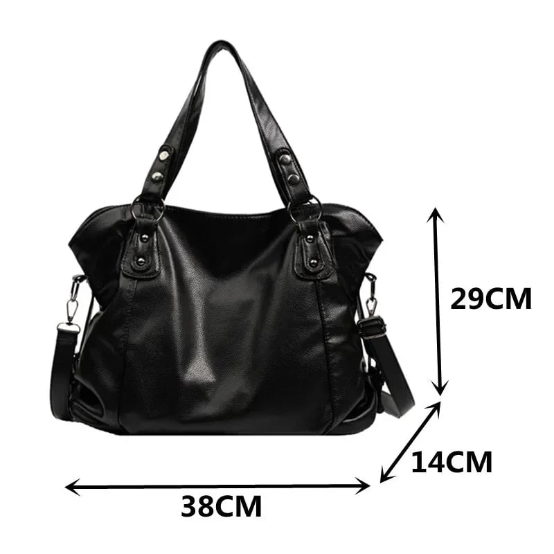 Model carrying the black Olivia shoulder bag on her shoulder in a casual outfit