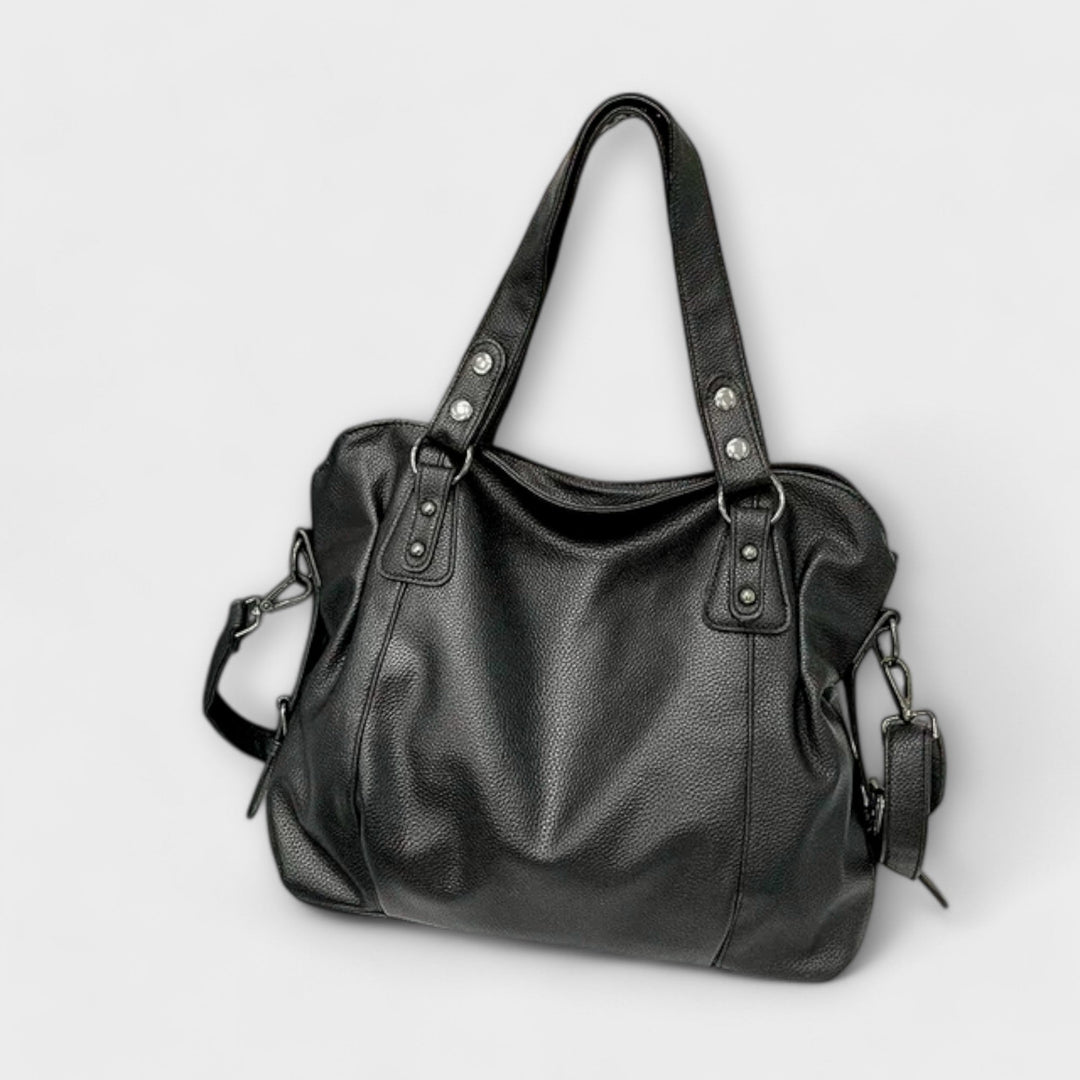 Interior view of the Olivia shoulder bag showing multiple compartments in brown