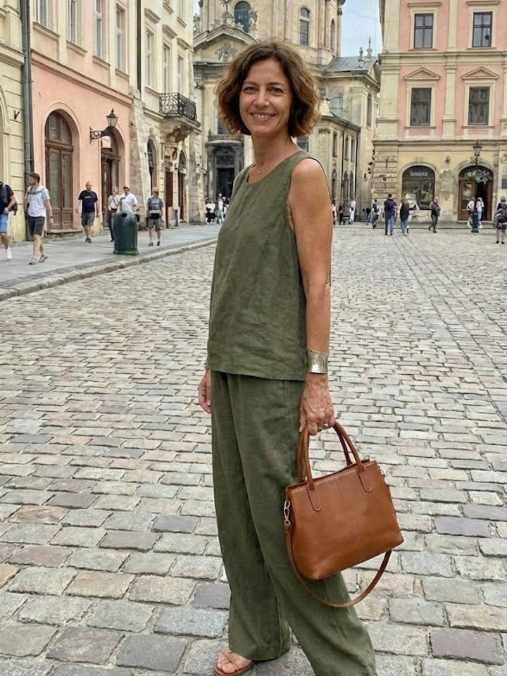 Model wearing the Olivia set in army green with flat sandals