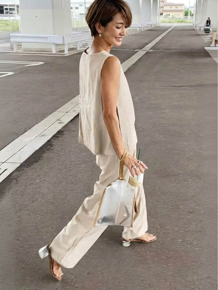 Model wearing the Olivia set in beige with mules