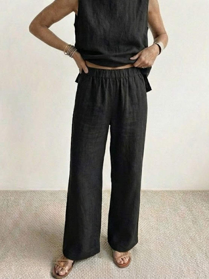 Olivia two-piece set in black showing elongating wide-leg silhouette