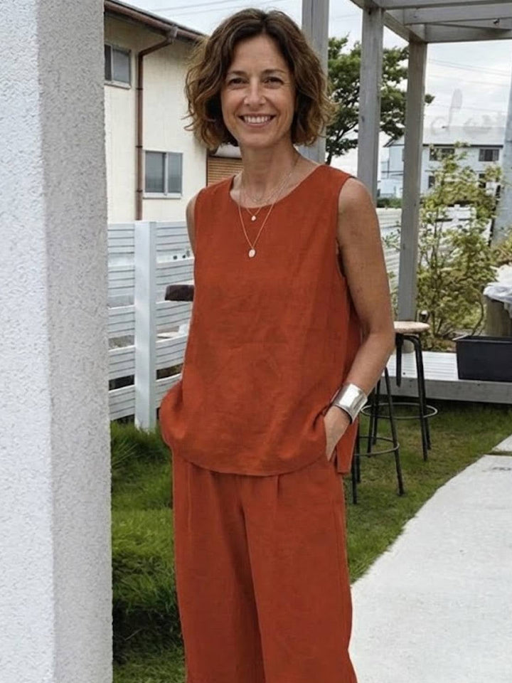 Close-up of crew neck tank top in rusty orange from the Olivia set