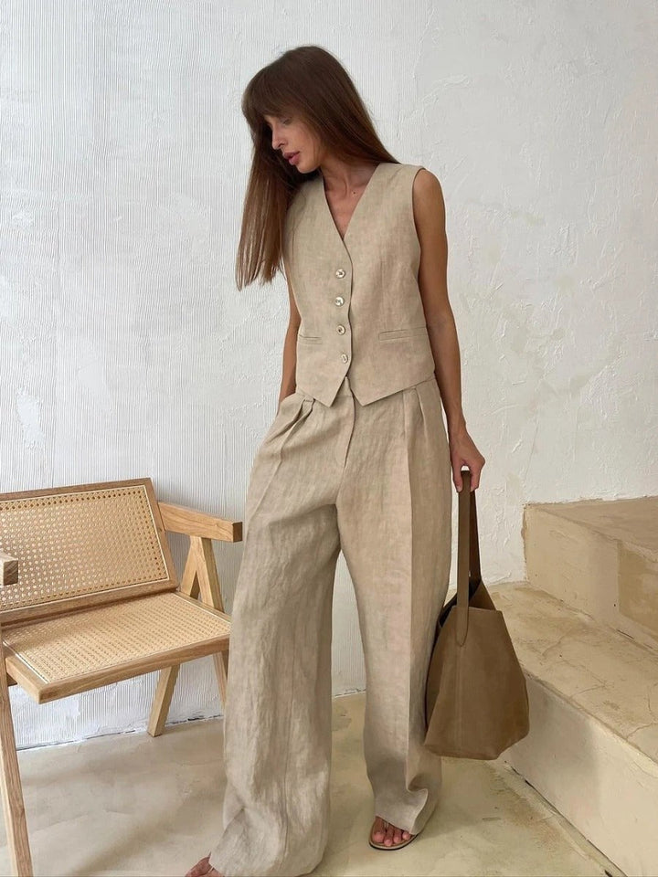 Model wearing the Effortless Chic Two-Piece Set in beige, featuring a sculpted vest and high-waisted wide-leg trousers