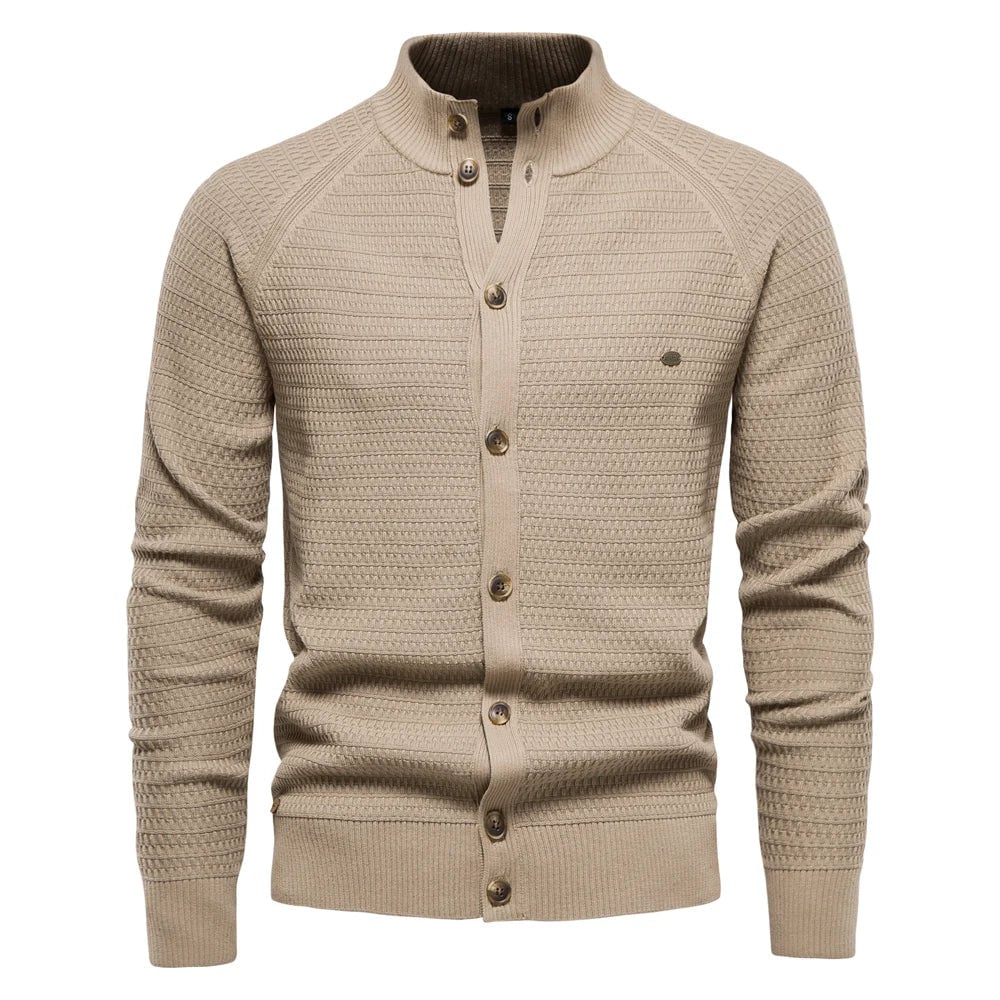 Model wearing the luxe cable-knit vest in khaki layered over a white shirt for a smart casual look
