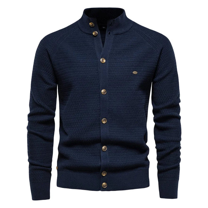 Side profile view of the tailored slim-fit silhouette of the cable-knit button vest in grey