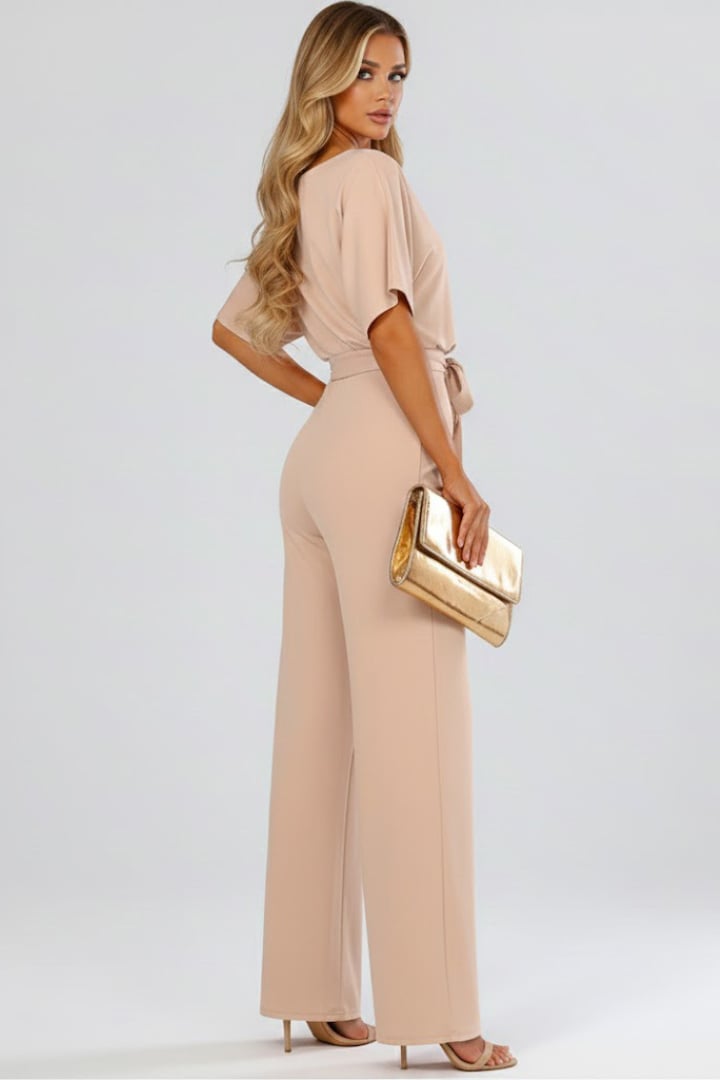 Side view of the Oona wide leg jumpsuit in black showing wide leg cut