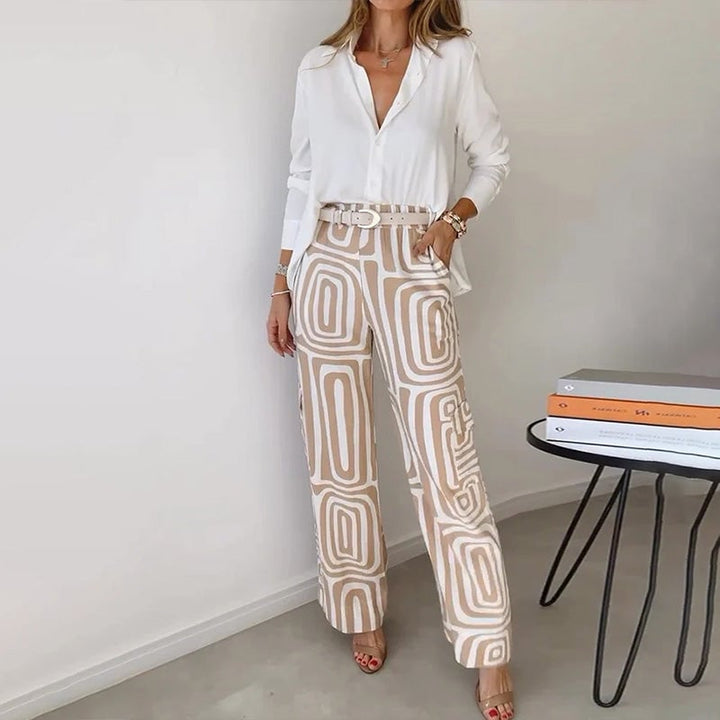 Model wearing the Opal elegant two-piece set in khaki with a flowing top and patterned trousers
