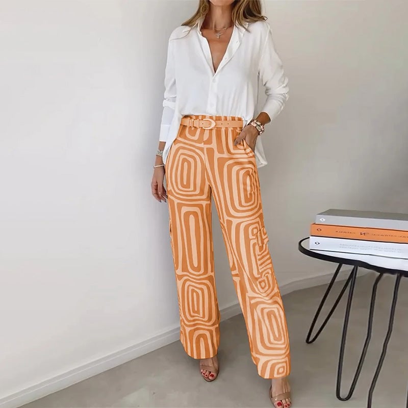 Flat lay of the Opal elegant two-piece set in orange showing the top and trouser pairing