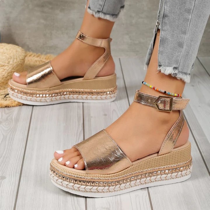 Lifestyle shot of Opal gold orthopedic sandals worn on feet, showcasing fit and elegant design