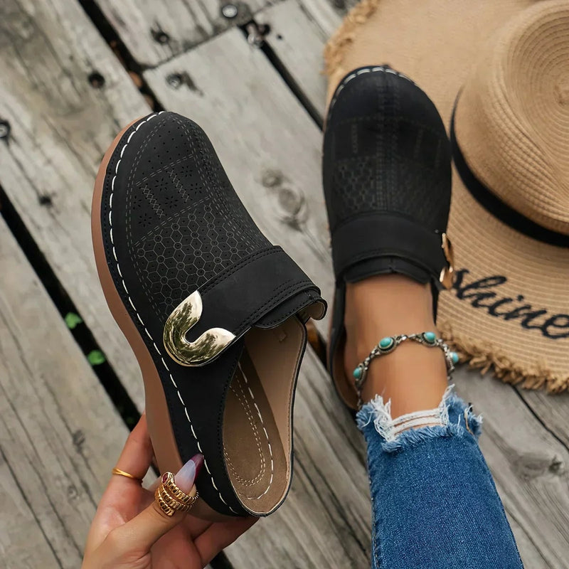 Ophelia adjustable wedge sandals in black, side profile view showing cushioned insole and wedge sole