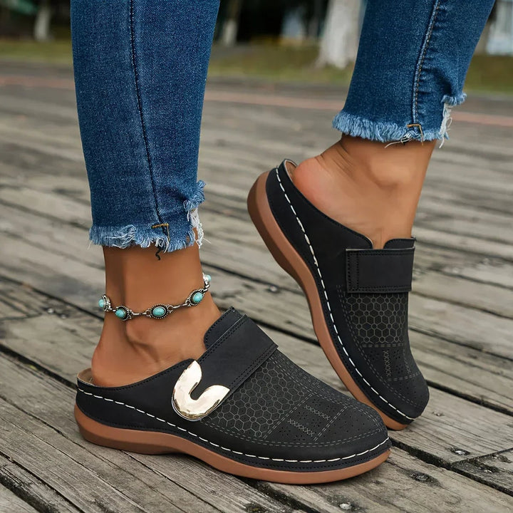 Ophelia adjustable wedge sandals worn on feet, showcasing wedge height and elegant profile