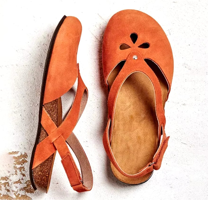 Orchid sandals styled on feet showing comfortable everyday wear on a casual outdoor surface