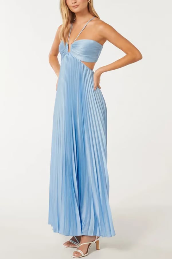 Back view of a blue halter maxi dress highlighting the open back and tie detail