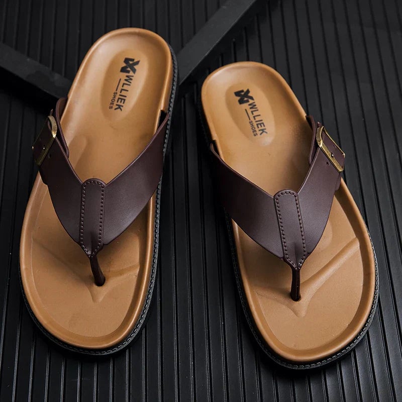 Close-up of Orla vegan leather sandal straps in black showing smooth premium texture