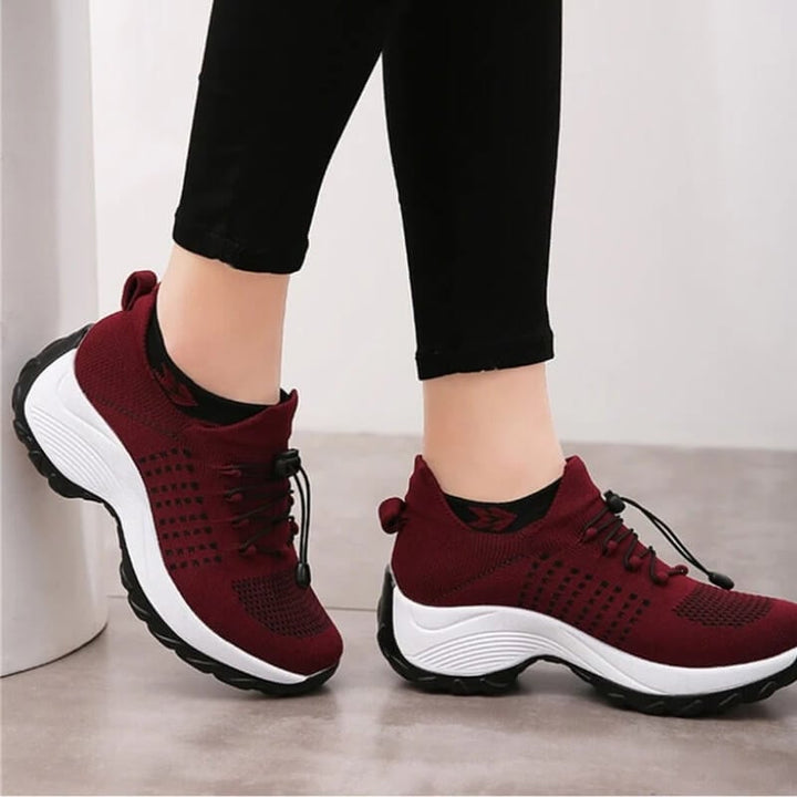 Woman wearing Florimay orthopedic comfort shoes while walking on pavement