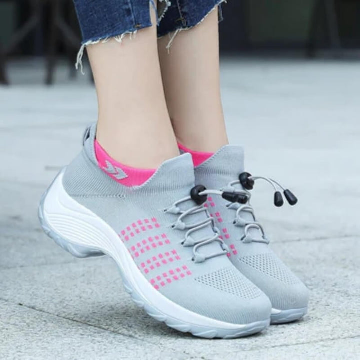 Pair of women's orthopedic shoes laid flat showing wide-fit adaptive construction