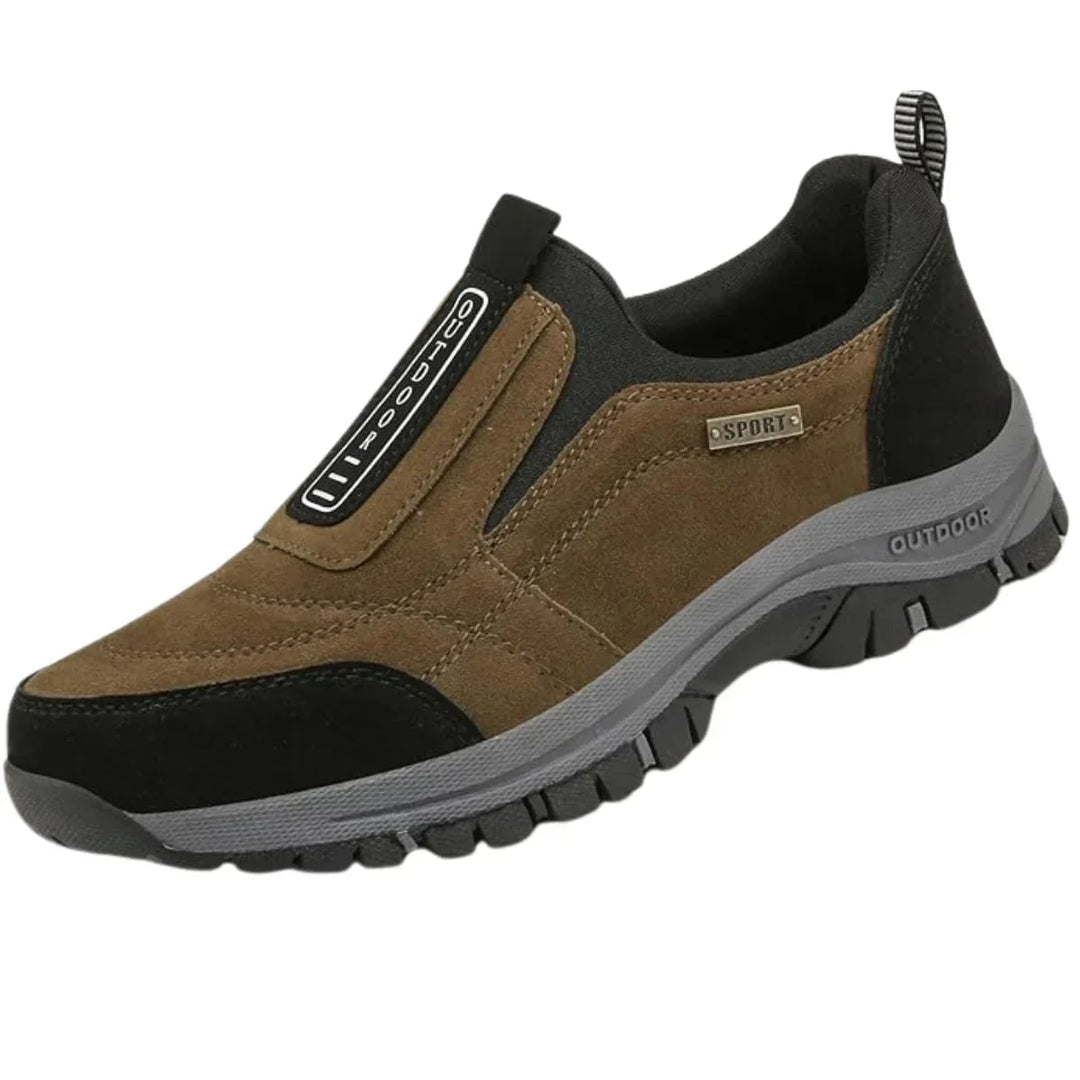 Side profile of men's khaki orthopedic walking shoe highlighting ergonomic sole design