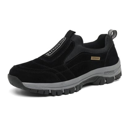Men wearing orthopedic walking shoes while walking outdoors on a trail path