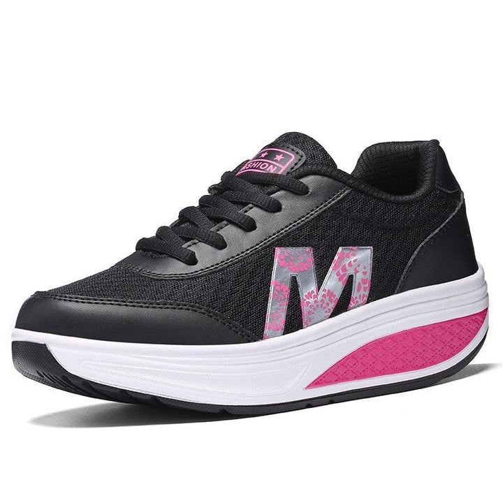 Ottilie orthopedic walking sneakers for women in black, shown from a front three-quarter angle