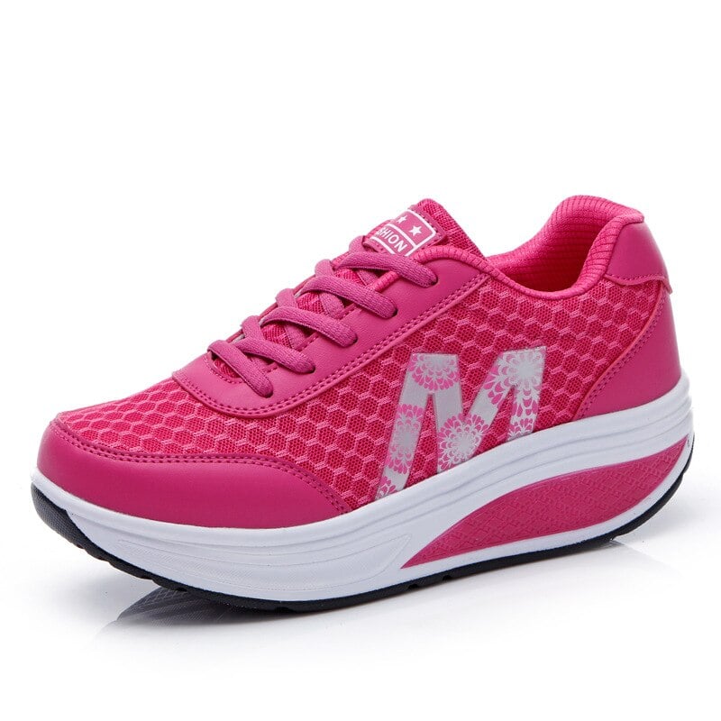 Side profile of Ottilie women's orthopedic sneakers highlighting the cushioned sole in black