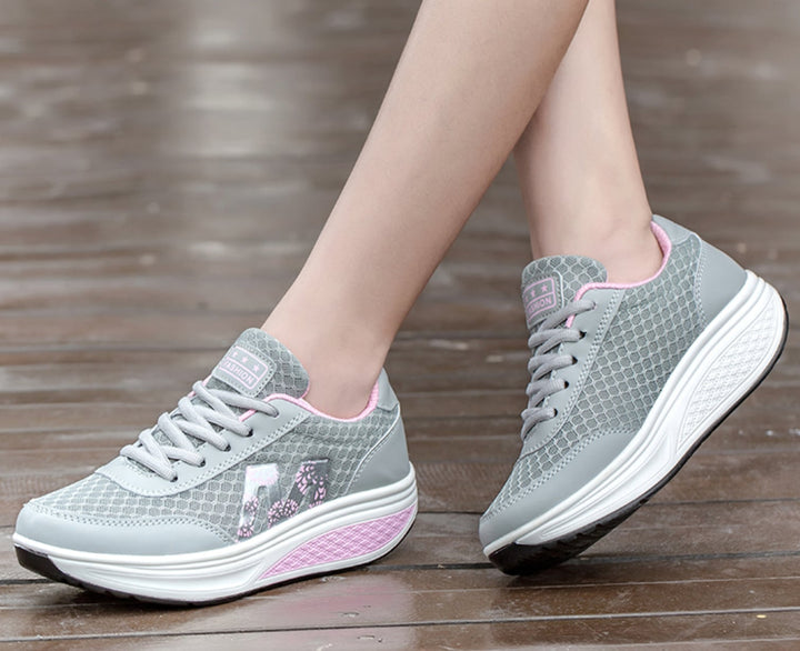 Ottilie orthopedic sneakers in blue shown from the side on a neutral background