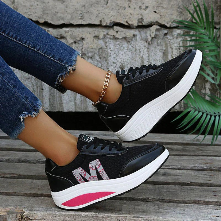 Back heel view of Ottilie orthopedic walking sneakers showing construction and stitching detail