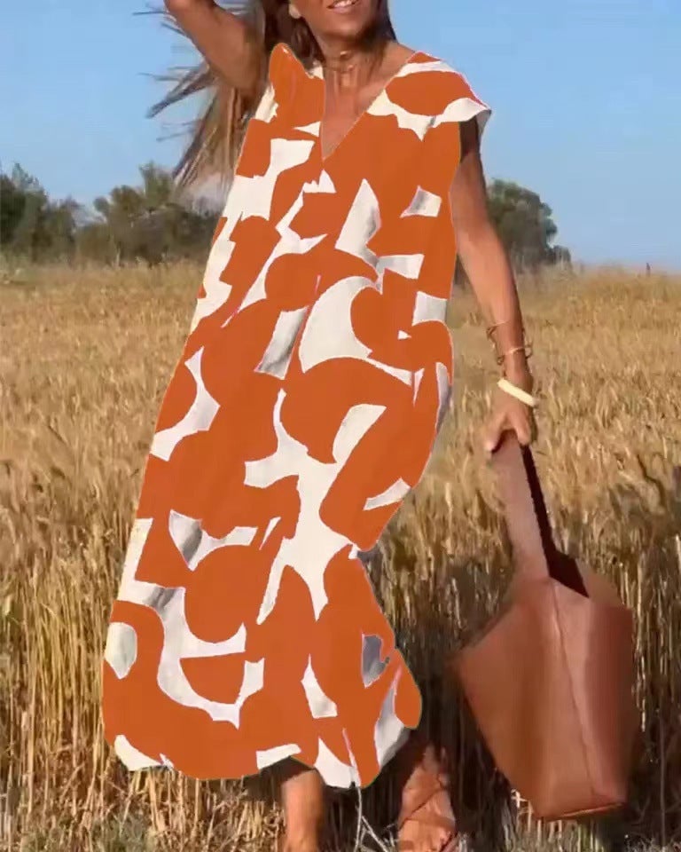 Back view of the Palmer flowy maxi dress highlighting the elegant drape and print