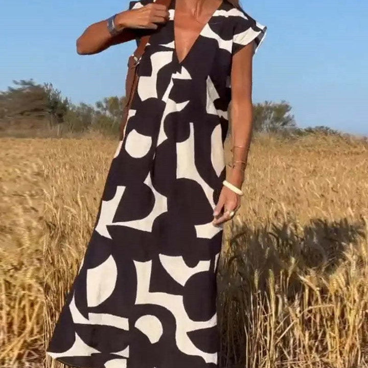Model in the Palmer maxi dress styled with heeled sandals for a dressed-up look