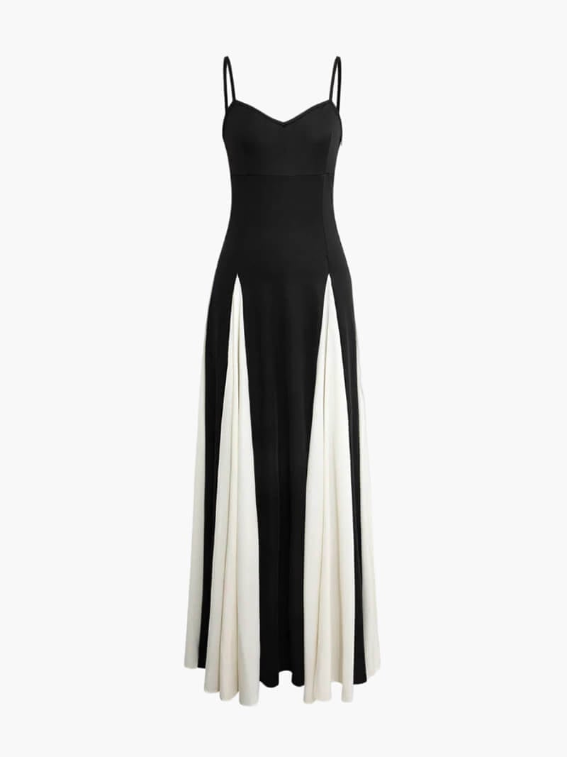 Back view of a black and white maxi dress showing the open-back detail and thin shoulder straps