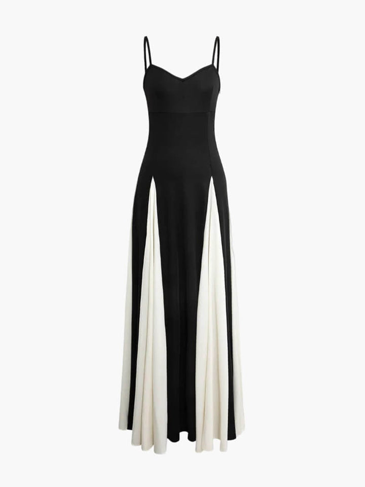 Back view of a black and white maxi dress showing the open-back detail and thin shoulder straps