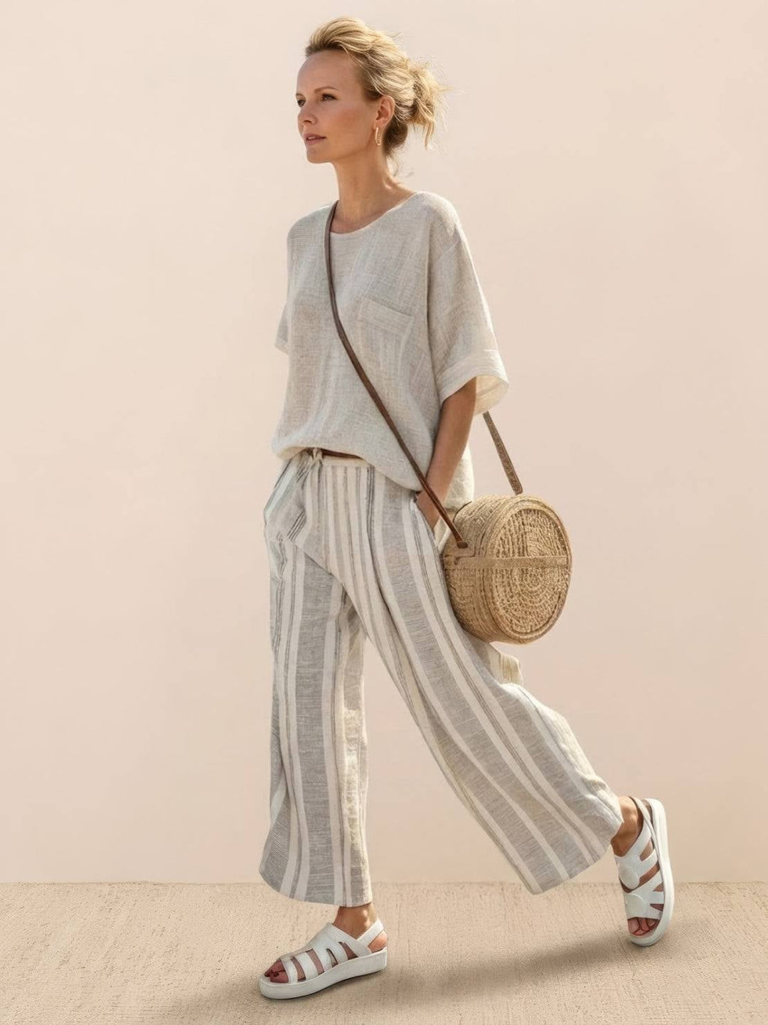 Paloma two-piece set featuring an oversized tee and striped wide-leg cropped pants in Neutral Stripes colorway