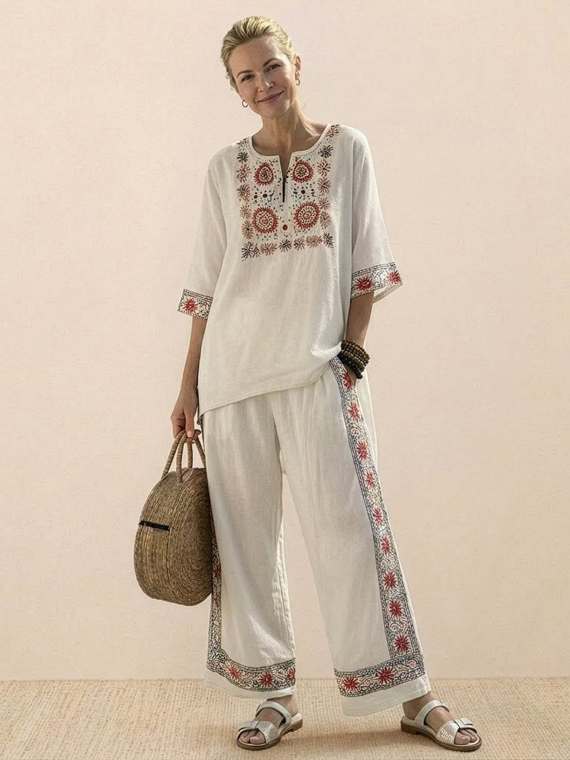 Front view of the Paloma wide-leg pants and tee set in Neutral Stripes on a female model