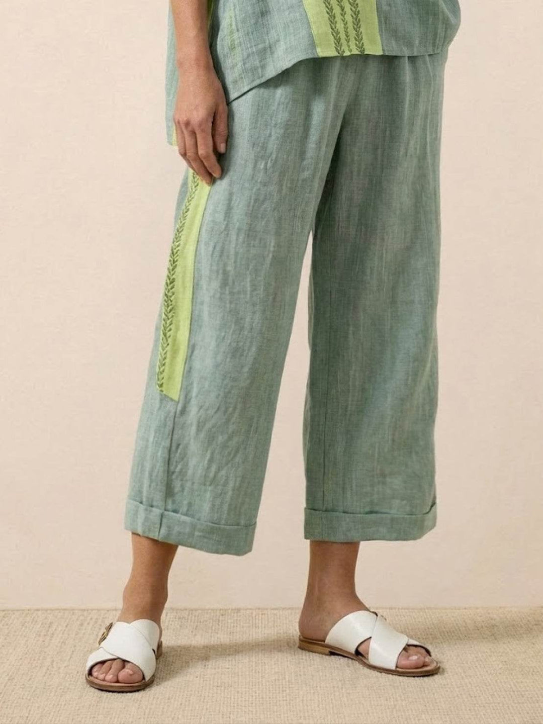Model wearing the Paloma tee half-tucked into the wide-leg pants