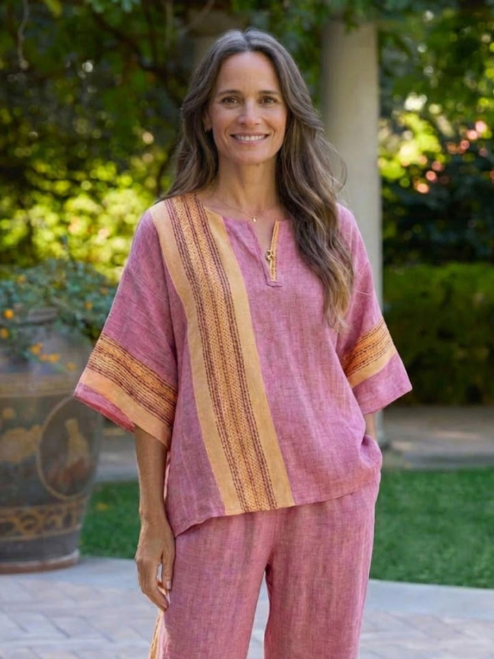 Paloma pants side view showing cropped wide-leg length and fabric drape