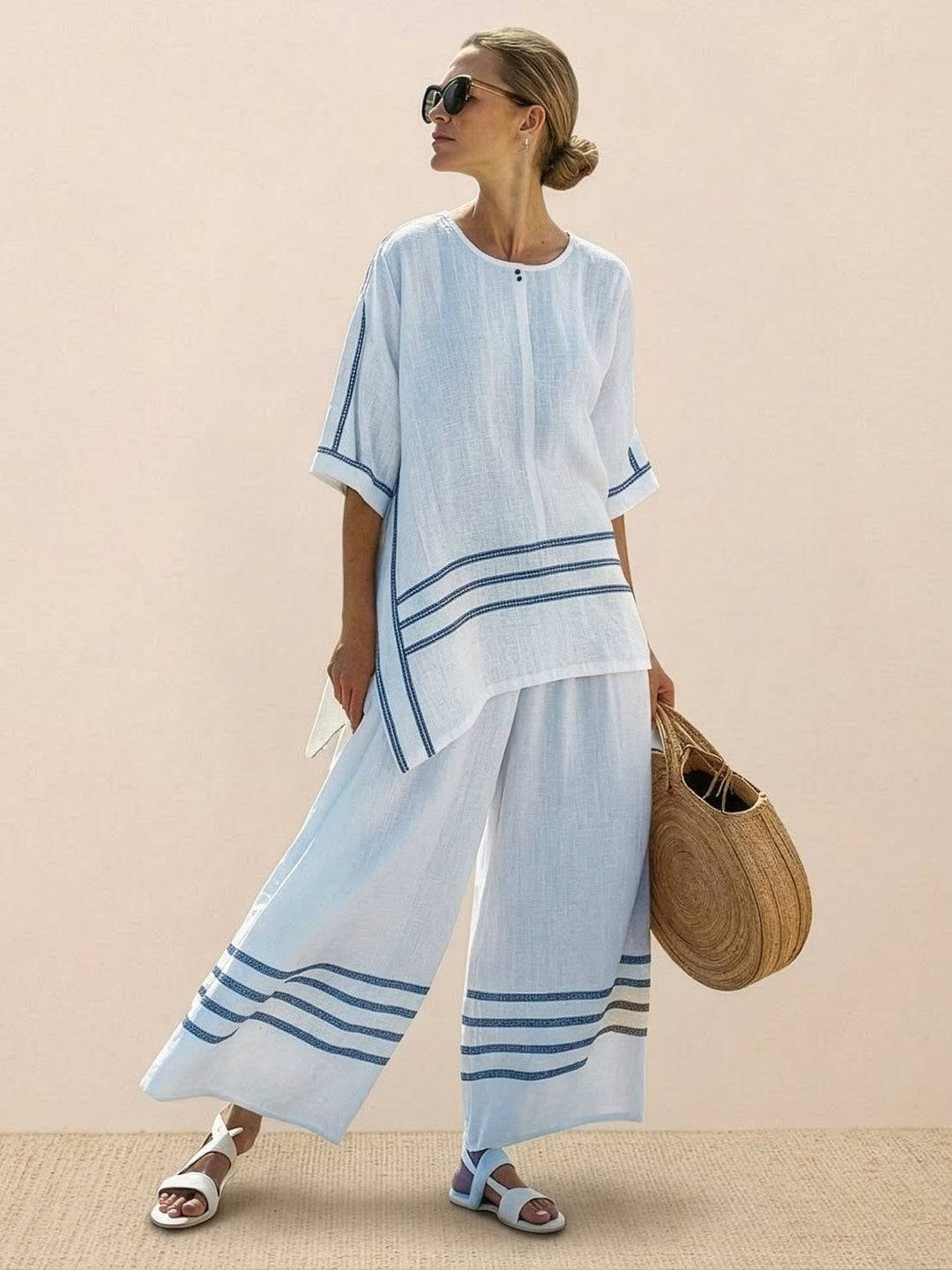Model standing with the Paloma set showing elongating wide-leg silhouette