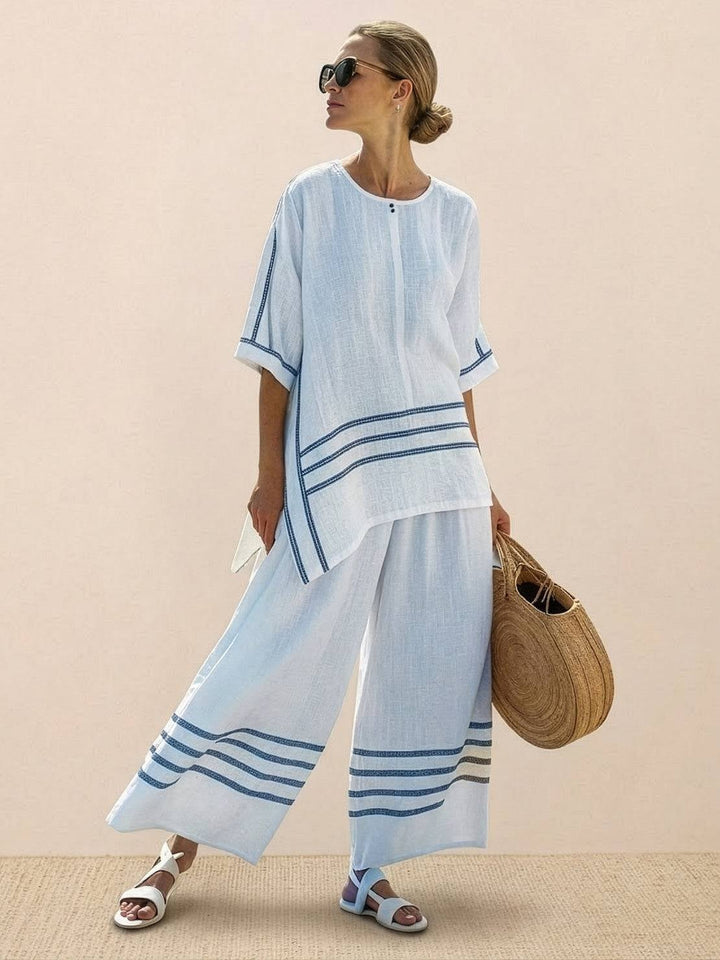 Model standing with the Paloma set showing elongating wide-leg silhouette