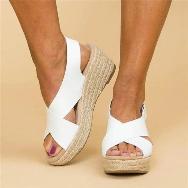 Paloma espadrille wedge sandal in white with cross-strap upper and slingback closure, side view