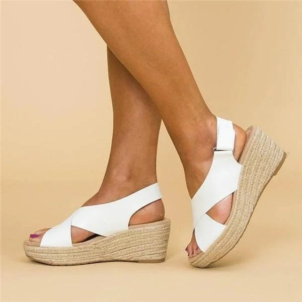 Pair of Paloma espadrille wedge sandals in white displayed from above on neutral background