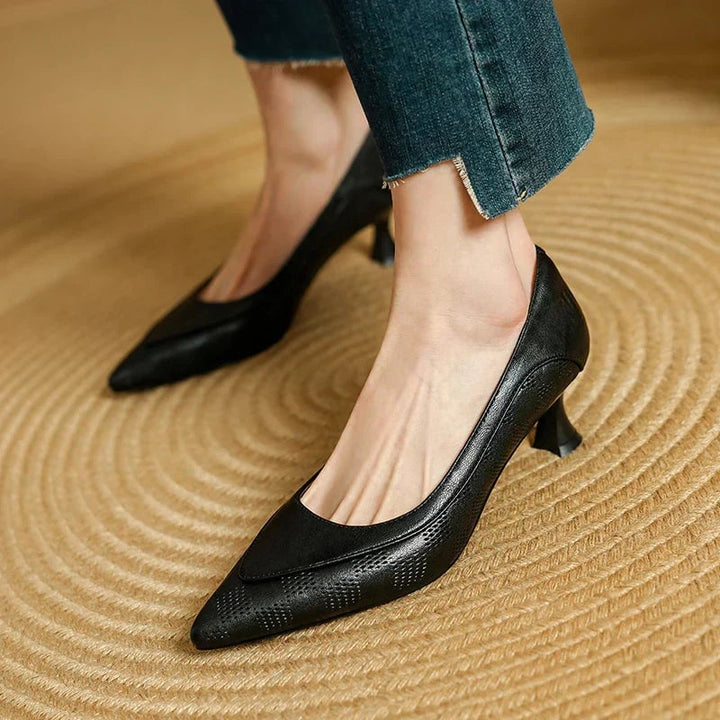 Paloma pointed toe kitten heel pumps in black, front three-quarter view