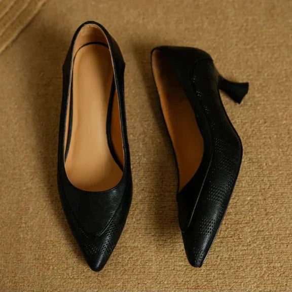 Paloma pointed toe kitten heel pumps in black, rear view showing sculpted heel