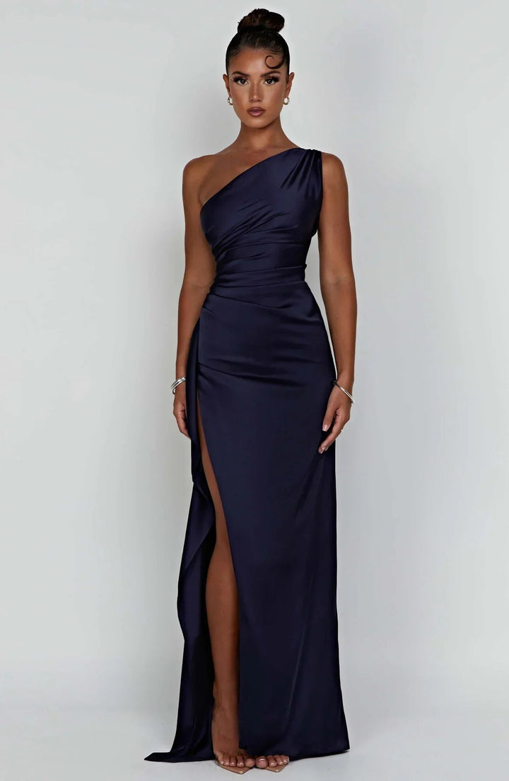 Navy blue one-shoulder maxi dress close-up of slit detail